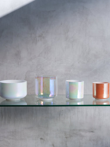Curated selection of Crystal Tones Alchemy Singing Bowls displayed in an elegant arrangement, showcasing their unique designs and vibrant colors, perfect for sound healing sessions or collectors seeking premium-quality instruments
